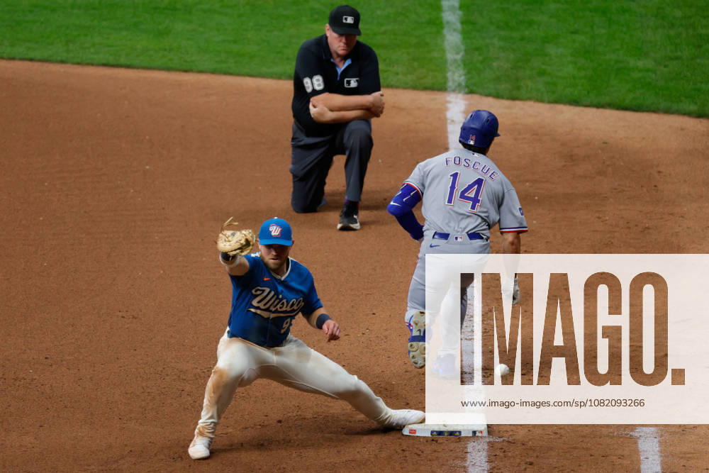 Texas Rangers second baseman JUSTIN FOSCUE (14) is safe at first after an errant throw in a baseball game, Friday, Aug. 28, 2026, in Milwaukee, Wisconsin. Milwaukee USA - ZUMAa325 20260828_zsa_a325_042