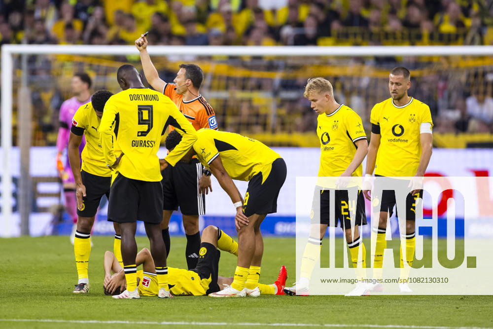 Soccer, Matchday 1 of the 1st Bundesliga, Borussia Dortmund vs. Hamburger SV BVB players surround the injured Giannis Konstantelias Borussia Dortmund Dortmund Signal Iduna Park NRW Germany xRHR PHOTO DEx