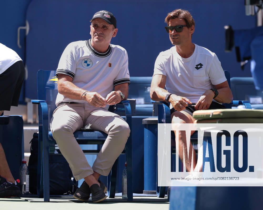 Carlos Alcaraz and his manager, Albert Molina, talking with David Ferrer on the sidelines during practice at the U.S. Open Championships, Billie Jean King National Tennis Center, Flushing Meadows, New York, USA