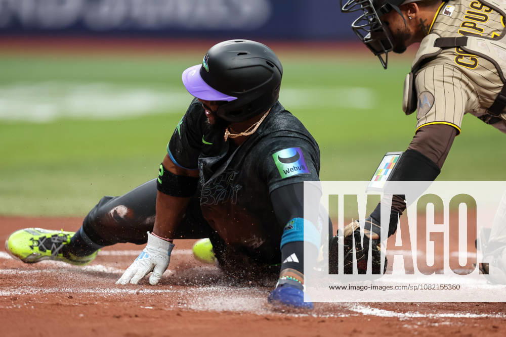 Tampa Bay Rays designated hitter YANDY DoÂAZ (2) slides into home plate to score a run against the San Diego Padres. The Tampa Bay Rays hosted the San Diego Padres at Tropicana Field in St. Petersburg, FL. St. Petersburg USA - ZUMAm299 20260829_znp_m299_036