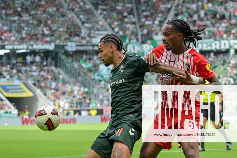 Justin Gideon Njinmah, SV Werder Bremen, No. 11, in a duel with Jordy Makengo, SC Freiburg, No. 33, Germany, SC Freiburg vs. Werder Bremen, Soccer, Bundesliga, Matchday 1, 2026–2027 Season, August 30, 2026 DFL DFB regulations prohibit any use of photographs as image sequences and or quasi-video GER, SC Freiburg vs. Werder Bremen, Soccer, Bundesliga, Matchday 1, 2026–2027 season, August 30, 2026, Freiburg