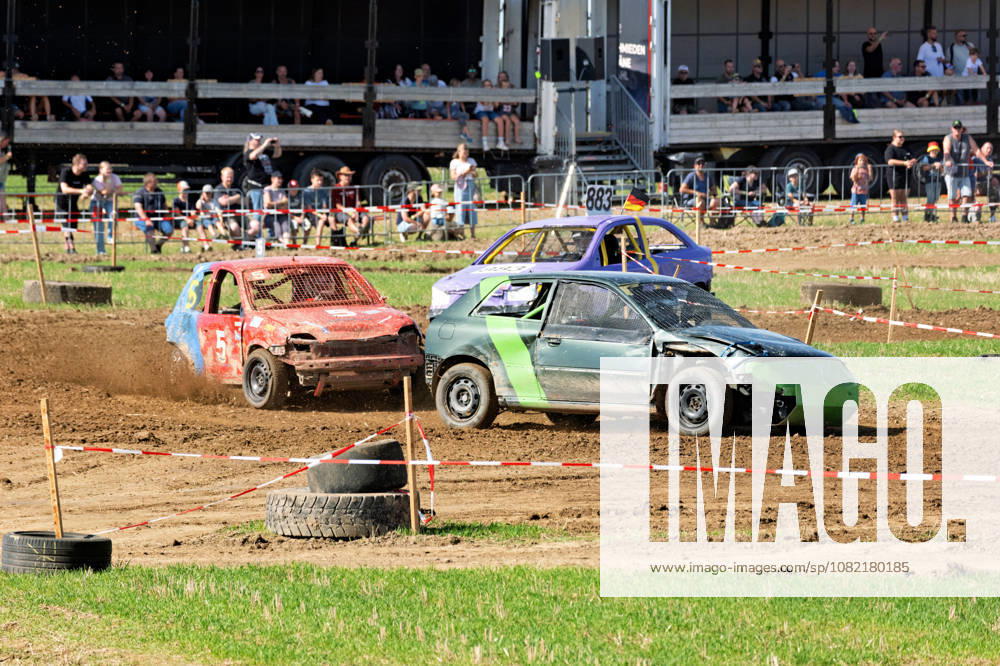 Three stock cars during a race at the FUN CROSS Stock Car Race organized by the Fun Cross Team Ummendorf at the racetrack near Dietenwengen FUN CROSS Stock Car Race in Eberhardzell Eberhardzell Dietenwengen