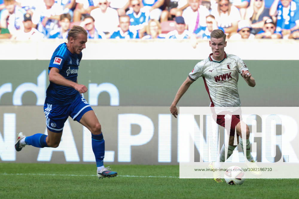 Anton Kade, FC Augsburg, No. 30 with the ball, with Schalke 05, GER, FC Augsburg vs. FC Schalke 04, Soccer, Bundesliga, Matchday 1, 2026–2027 Season, August 30, 2026, DFL and DFB regulations prohibit any use of photographs as image sequences and or quasi-video, GER, FC Augsburg vs. FC Schalke 04, soccer, Bundesliga, Matchday 1, 2026–2027 season, August 30, 2026, Augsburg