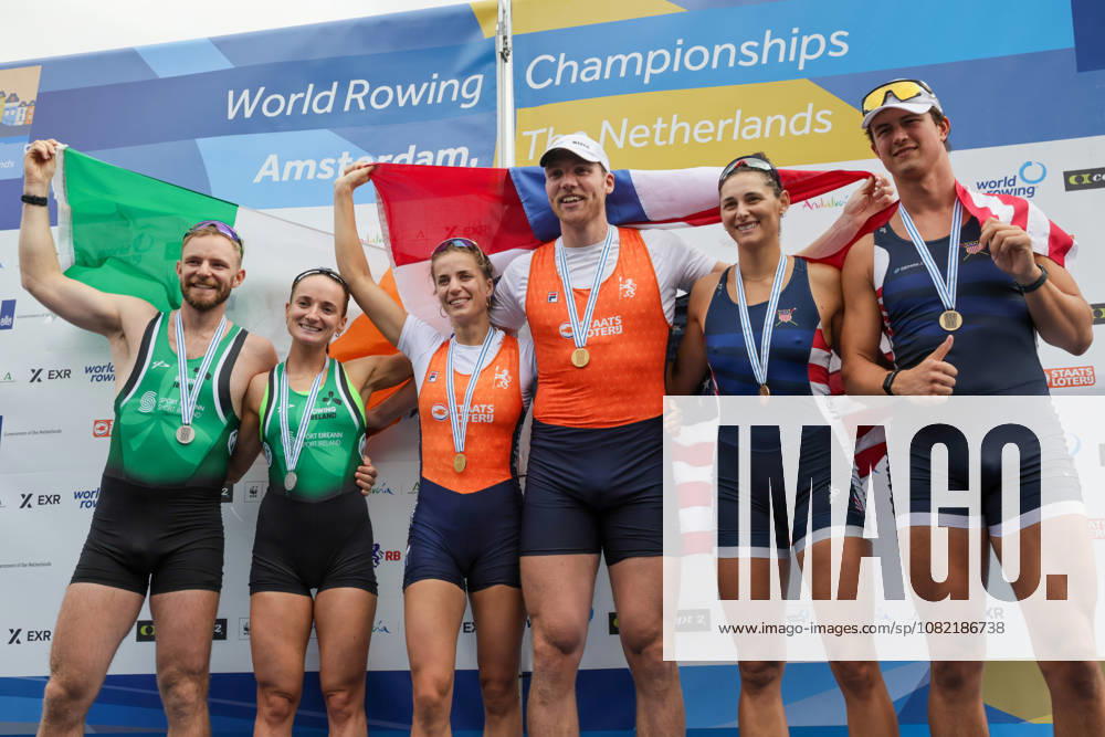 30th August 2026; Bosbaan, Amsterdam, Holland, Netherlands; 2026 World Rowing Championships, Final Day; the medal ceremony; Ireland Mixed Double Sculls (Mix2x) with Konan Pazzaia and Margaret Cremen silver medallists, Netherlands Mixed Double Sculls (Mix2x) with Roos de Jong and Simon van Dorp gold medallists and United States Mixed Double Sculls (Mix2x) with Sophia Vitas and Cedar Cunningham bronze medallists AnthonyxBenoit