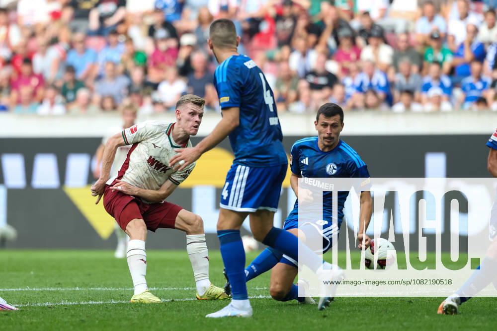 Anton Kade (FC Augsburg), 30, with Ron Schallenberg (FC Schalke 04), 06, and Hasan Kurucay (FC Schalke 04), 04, GER, FC Augsburg vs. FC Schalke 04, Soccer, Bundesliga, Matchday 1, 2026–2027 Season, August 30, 2026, DFL and DFB regulations prohibit any use of photographs as image sequences and or quasi-video, GER, FC Augsburg vs. FC Schalke 04, soccer, Bundesliga, Matchday 1, 2026–2027 season, August 30, 2026, Augsburg