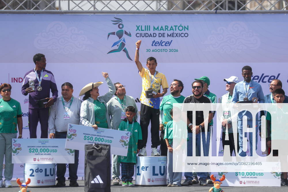 43rd edition of the Mexico City Marathon Peruvian Cristhian Pacheco Mendoza (C), first place, and Ethiopians Anbesa Tesfaye Lencho (L), second place, and Balew Yihunie Derseh (R), third place, celebrate during the awards ceremony for the 43rd edition of the Mexico City Marathon 2026 in Mexico City, Mexico, 30 August 2026. Ciudad de México (es-ES) Mexico