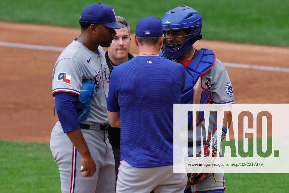 Texas Rangers pitcher KUMAR ROCKER (80) and Texas Rangers catcher ELIAS DIAZ (35) have a discussion with Texas Rangers pitching coach JORDAN TIEGS (83) in a baseball game, Sunday, Aug. 30, 2026, in Milwaukee, Wisconsin. Milwaukee USA - ZUMAa325 20260830_zsa_a325_012