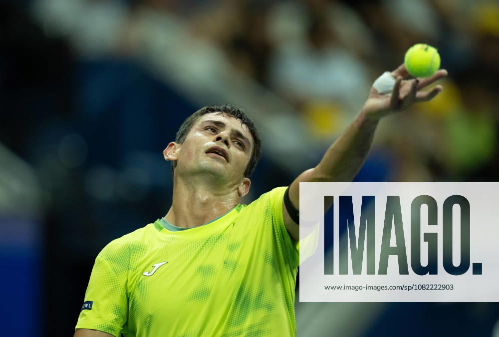 2026 US Open - Day 1 NEW YORK, NEW YORK - AUGUST 30: Mariano Navone of Argentina tosses the ball to serve during his match against Novak Djokovic of Serbia during the 2026 US Open - Day 1 at USTA Billie Jean King National Tennis Center on August 30, 2026 in New York, New York. New York USTA Billie Jean King National Tennis Center New York United States