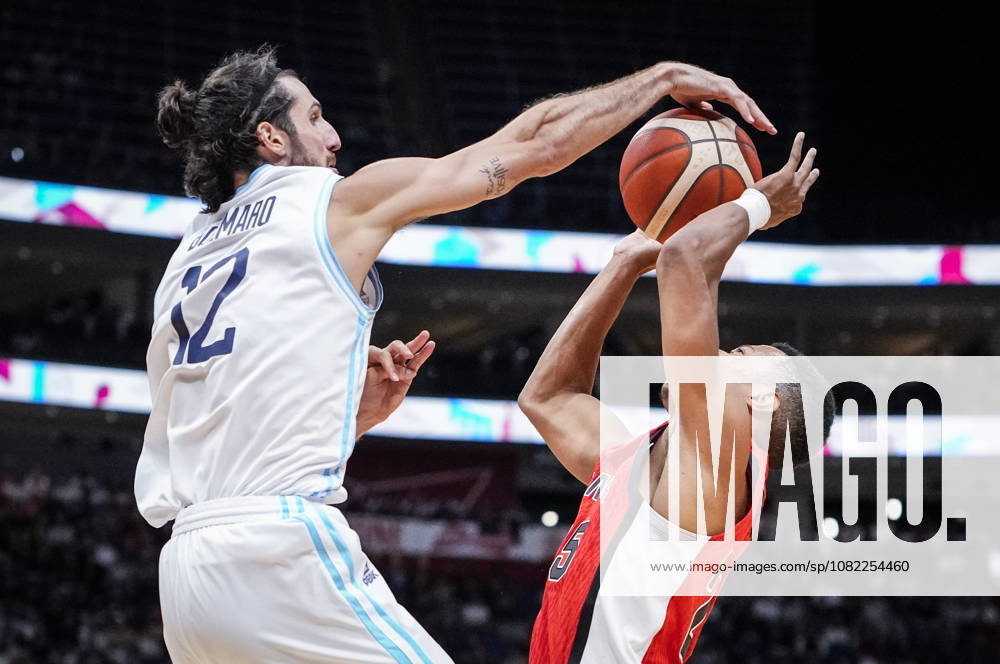 Argentina s Leandro Bolmaro (12) blocks Canada s Trae Bell-Haynes (25) during their FIBA world cup qualification action in Quebec City, Monday, Aug. 31, 2026. Trae Bell-Haynes (25) Leandro Bolmaro (12) - ZUMAc35_ 20260831_zaf_c35_090