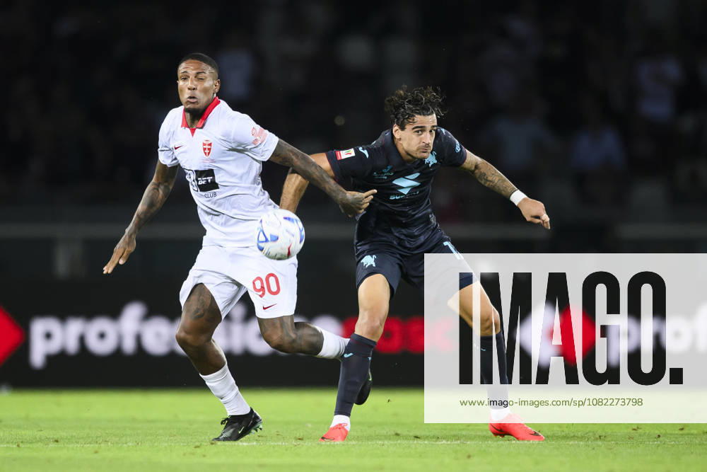 Torino FC v AC Monza - Coppa Italia Michael Folorunsho of AC Monza competes for the ball with Sandro Kulenovic of Torino FC during the Coppa Italia football match between Torino FC and AC Monza. Turin Italy