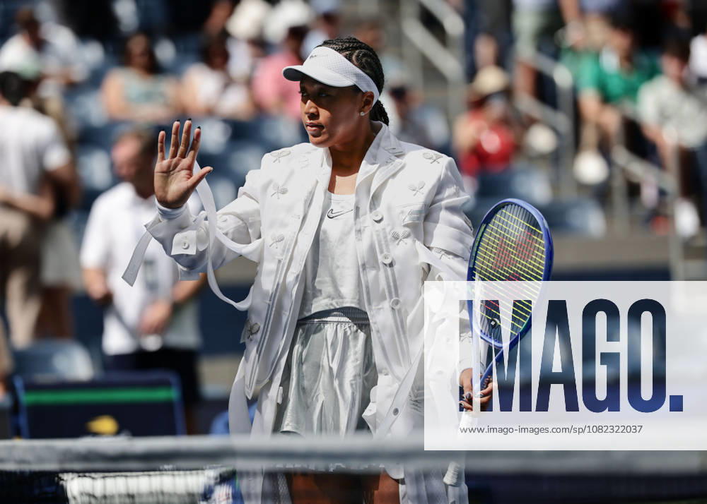 Naomi Osaka stands at the net before the match begins, U.S. Open Championships, Billie Jean King National Tennis Center, Flushing Meadows, New York, USA