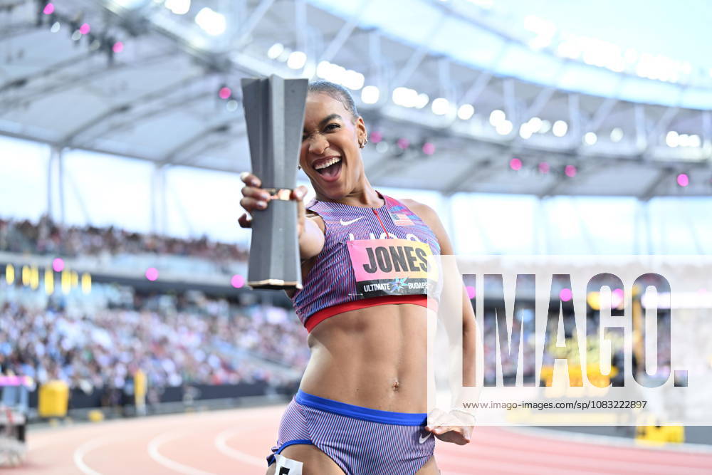World Athletics Ultimate Championship - Budapest: Day Three BUDAPEST, HUNGARY - SEPTEMBER 13: Jasmine Jones of Team United States lifts her World Athletics Ultimate Championship trophy after victory in the Women s 400 Metres Hurdles Final during Day 3 of the World Athletics Ultimate Championship at National Athletics Centre on September 13, 2026 in Budapest, Hungary. Mustafa Yalcin Anadolu Budapest Hungary. Editorial use only. Please get in touch for any other usage.