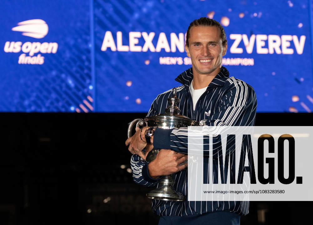 2026 US Open - Day 15 NEW YORK, NEW YORK - SEPTEMBER 13: Alexander Zverev of Germany poses with the trophy in front of the Arthur Ashe Stadium after winning the mens singles final against Ben Shelton of the United States (not pictured) during the 2026 US Open - Day 15 at USTA Billie Jean King National Tennis Center on September 13, 2026 in New York, New York. New York USTA Billie Jean King National Tennis Center New York United States