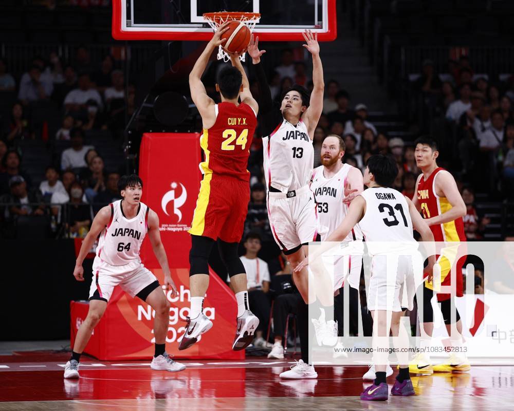 Aichi-Nagoya Asian Games: Basketball Japan s Ren Kanechika (13) blocks China s Cui Yongxi from shooting during the third quarter of a men s basketball semifinal match at the Aichi-Nagoya Asian Games at Aichi International Arena in Nagoya, central Japan, on Sept. 18, 2026. A14AA0005627854P