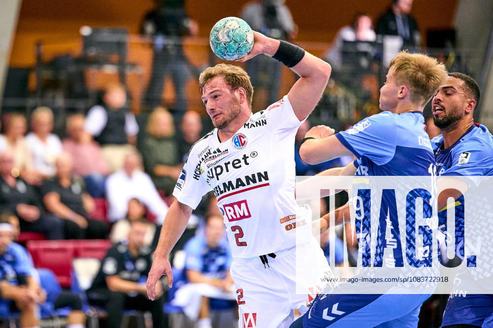 Frieder Bandlow 2, HC Erlangen, in a one-on-one with Linus Schmid 19, TVB 1898 Stuttgart, and Philipp Ahouansou 5, TVB 1898 Stuttgart September 24, 2026 Handball DHB Cup 2026–2027 Season, Round 2: TVB 1898 Stuttgart vs. HC Erlangen, Nuremberg Metropolitan Region, HCE PeKo