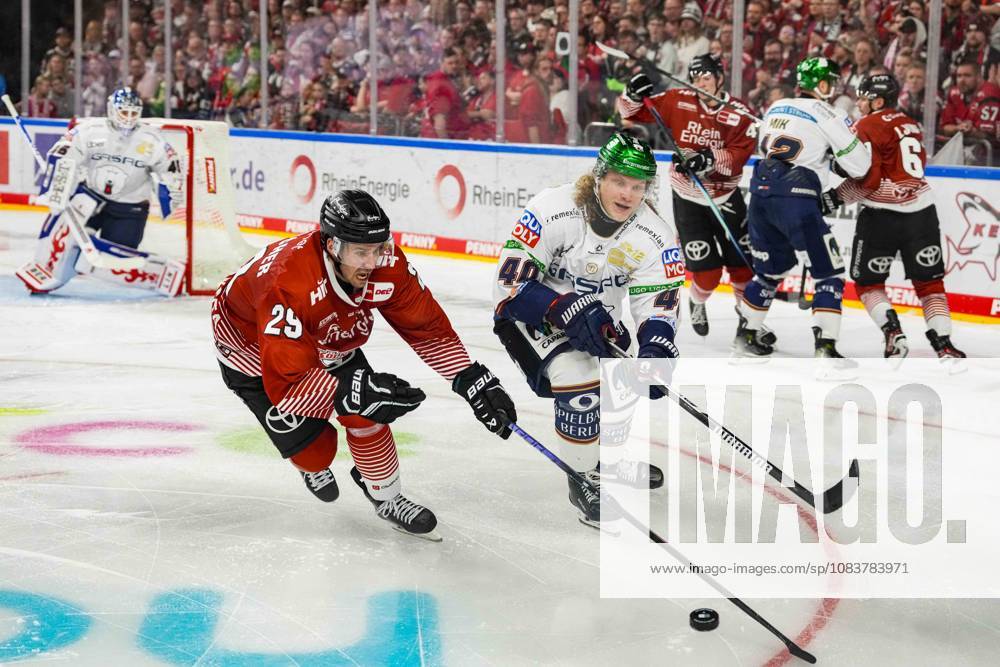 Ice Hockey: Penny DEL, Match Day 3—Cologne Sharks vs. Berlin Eisbären on September 25, 2026, at the Lanxess Arena in Cologne; Tim Fleischer (Cologne), left: Korbinian Geibel (Berlin), right: In accordance with the regulations of the DEL (German Ice Hockey League), the publication and further use of the images in electronic media and on devices of any kind during the game is not permitted