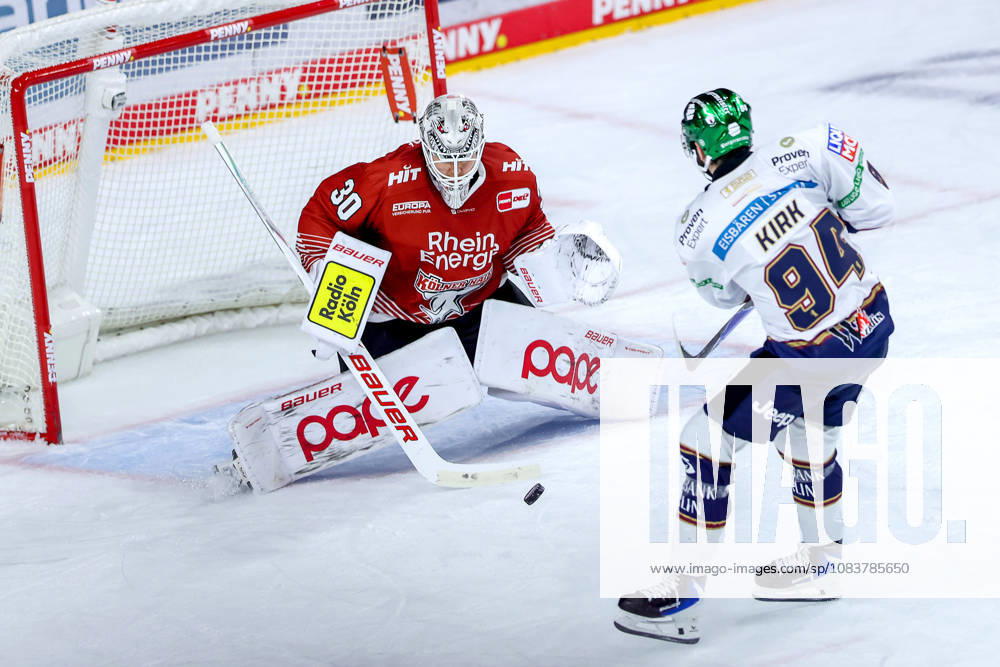 Ice Hockey, DEL, Kölner Haie vs. Eisbären Berlin, Matchday 3, 2026–27 Season, Lanxess Arena, Cologne: Goalie Janne Juvonen of the Kölner Haie makes a save in the shootout against Liam Kirk of the Eisbären Berlin in overtime, North Rhine-Westphalia, Germany