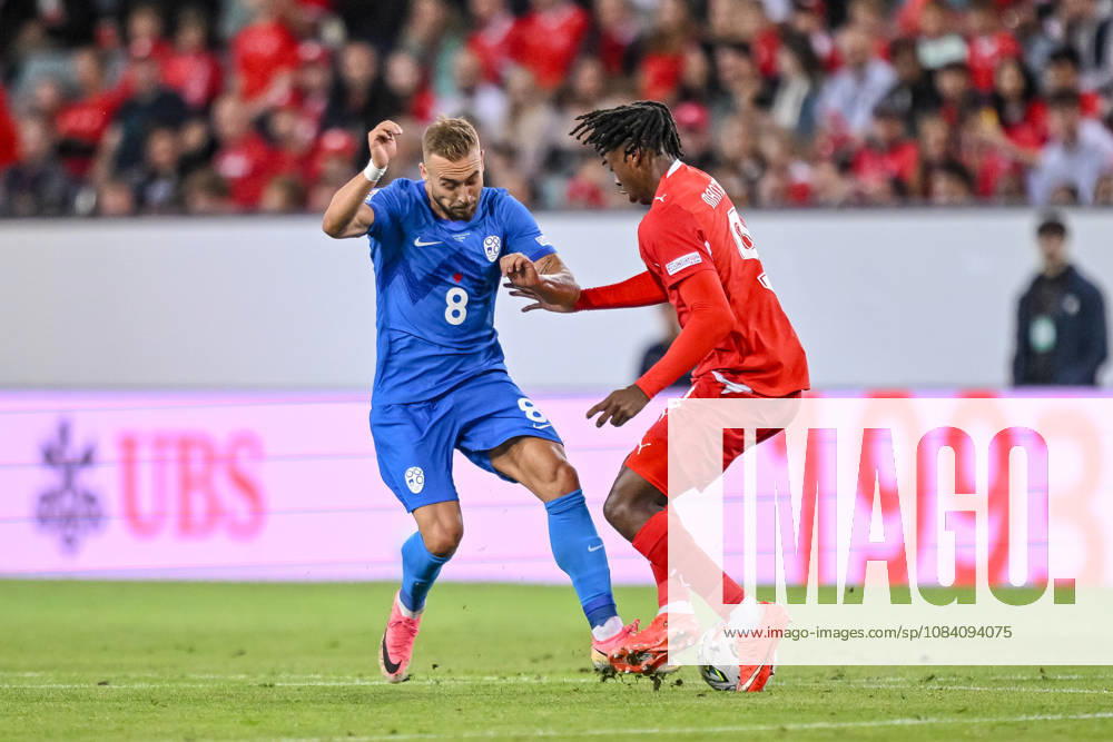 Sandi Lovric of Slovenia and Johan Manzambi of Switzerland battle for the ball during the UEFA Nations League 2026–27 group stage match between Switzerland and Slovenia at Luzern Arena on October 3, 2026, in Lucerne, Switzerland. Photo by Harry Langer, DeFodi Images