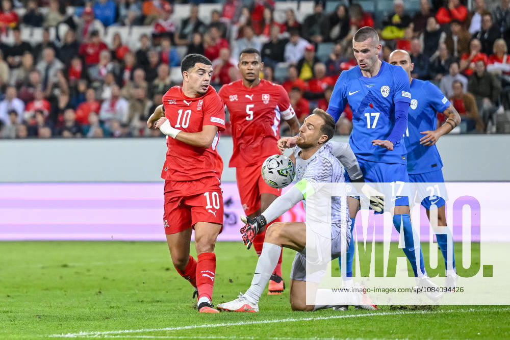 Zeki Amdouni of Switzerland and goalkeeper Jan Oblak of Slovenia battle for the ball during the UEFA Nations League 2026–27 group stage match between Switzerland and Slovenia at Luzern Arena on October 3, 2026, in Lucerne, Switzerland. Photo by Harry Langer, DeFodi Images