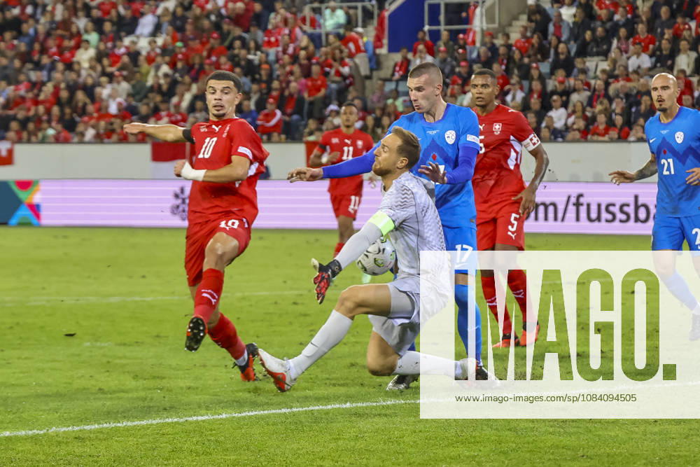 Zeki Amdouni (Switzerland), 10, Jan Oblak (Slovenia), 01, and David Zec (Slovenia), 17, battling for the ball; Switzerland, UEFA Nations League, Matchday 3, Switzerland vs. Slovenia, October 3, 2026, Lucerne Swissporarena, Switzerland