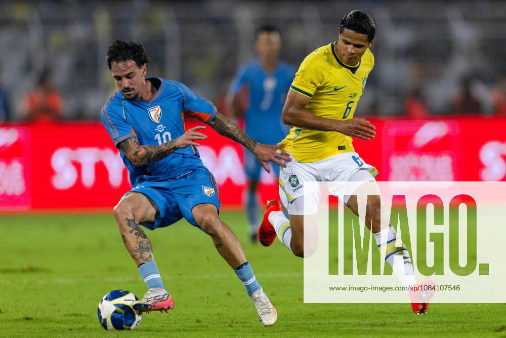Ryan Williams of India and Douglas dos Santos Justino de Melo of Brazil duel for the ball during friendly match between India and Brazil at the Vivekananda Yuba Bharati Krirangan (VYBK) Stadium in Kolkata, India on 3rd October, 2026