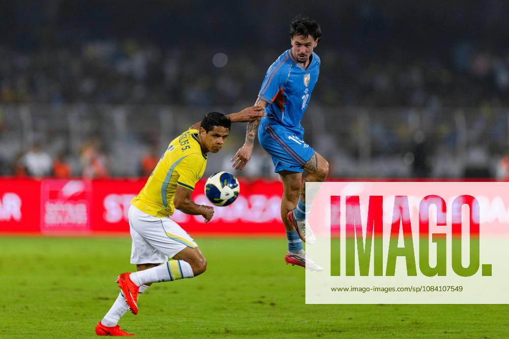 Ryan Williams of India and Douglas dos Santos Justino de Melo of Brazil duel for the ball during friendly match between India and Brazil at the Vivekananda Yuba Bharati Krirangan (VYBK) Stadium in Kolkata, India on 3rd October, 2026