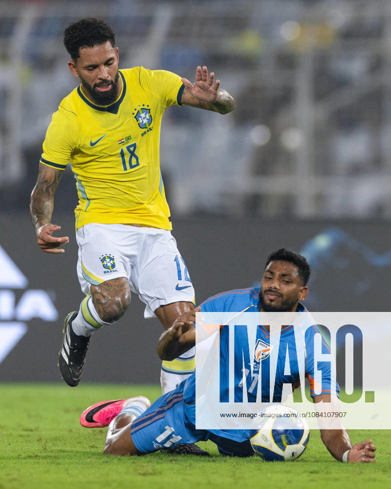 Douglas Luiz Soares de Paulo of Brazil and Rahim Ali of India duel for the ball during friendly match between India and Brazil at the Vivekananda Yuba Bharati Krirangan (VYBK) Stadium in Kolkata, India on 3rd October, 2026