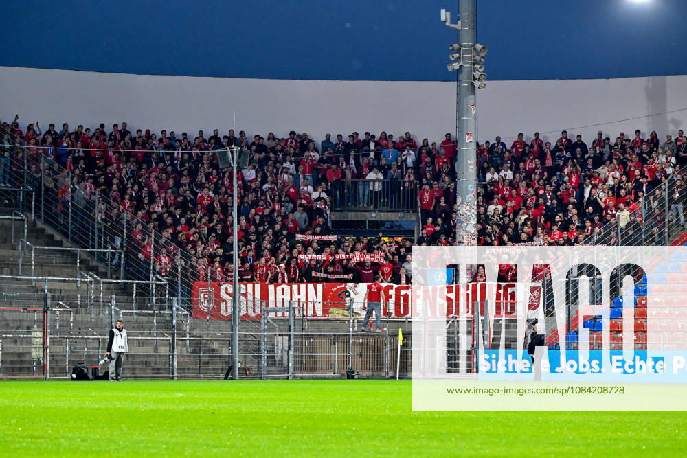 Regensburg fans, packed visiting fan section, fans, crowd, spectators, atmosphere, stadium, October 6, 2026, Unterhaching, Germany, soccer, BFV Association Cup, quarterfinals, SpVgg Unterhaching vs. SSV Jahn Regensburg