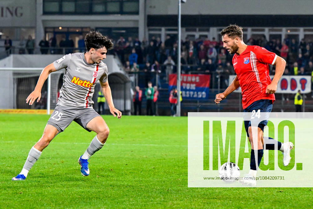 From left: Nicolas Oliveira (Regensburg), 25; Moritz Mueller (Unterhaching), 24; in a one-on-one battle, duel, tackle, dynamic play, action, October 6, 2026, Unterhaching, Germany, soccer, BFV Association Cup, quarterfinals, SpVgg Unterhaching vs. SSV Jahn Regensburg