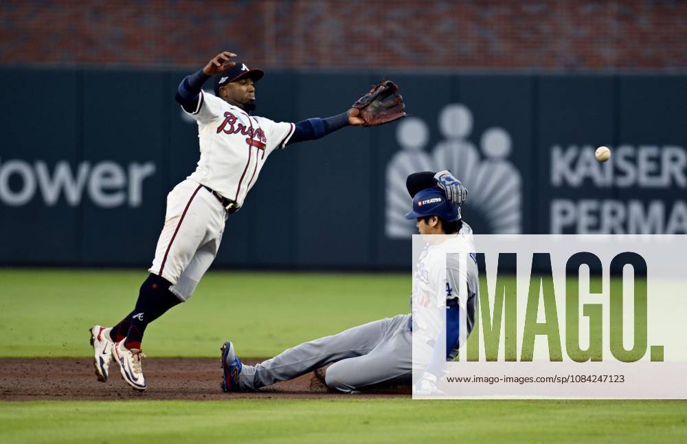 Baseball: Division Series between Dodgers and Braves Los Angeles Dodgers designated hitter Shohei Ohtani (R) steals second base as Atlanta Braves second baseman Ozzie Albies fails to gather the ball during the second inning of Game 4 of the National League Division Series at Truist Park in Atlanta on Oct. 7, 2026. A14AA0005630402P