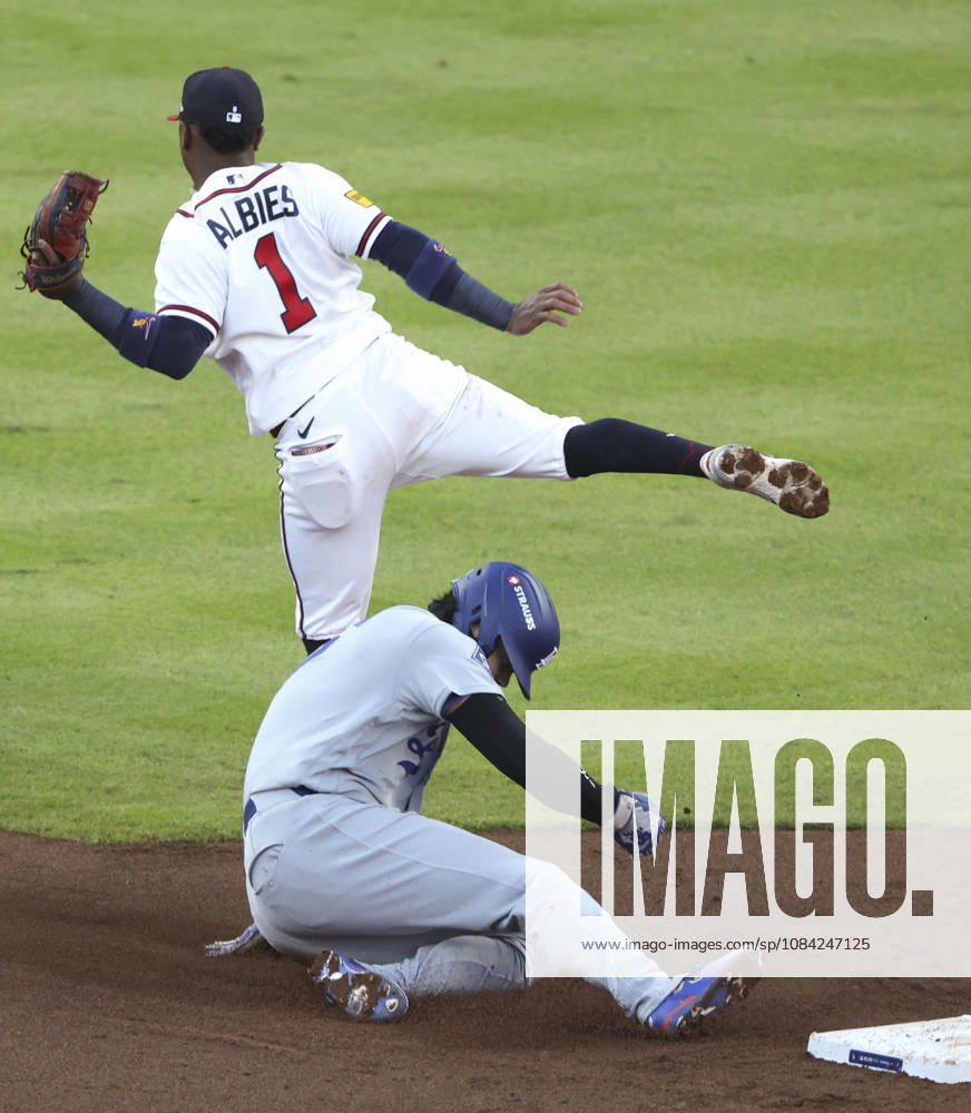 Baseball: Division Series between Dodgers and Braves Los Angeles Dodgers designated hitter Shohei Ohtani steals second base as Atlanta Braves second baseman Ozzie Albies (1) fails to gather the ball during the second inning of Game 4 of the National League Division Series at Truist Park in Atlanta on Oct. 7, 2026. A14AA0005630404P