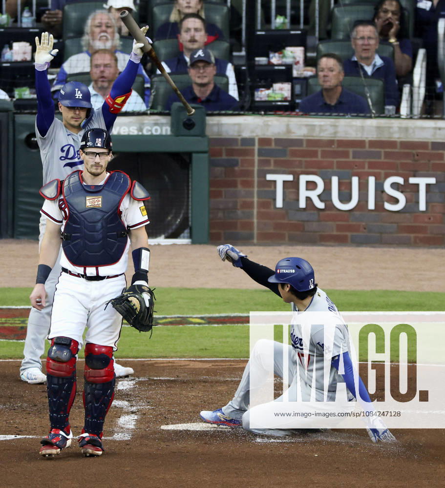 Baseball: Division Series between Dodgers and Braves Los Angeles Dodgers designated hitter Shohei Ohtani (R) slides home safely after a fielding error by Atlanta Braves shortstop Mauricio Dubon as Braves catcher Sean Murphy (L) looks on during the second inning of Game 4 of the National League Division Series at Truist Park in Atlanta on Oct. 7, 2026. A14AA0005630407P
