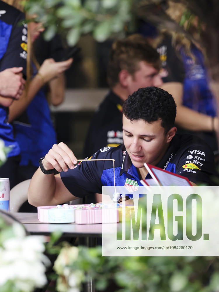 ISACK HADJAR of Oracle Red Bull Racing enjoys a light-hearted moment playing a fishing game in the team s hospitality area in the paddock ahead of the 2026 Formula 1 Singapore Grand Prix at Marina Bay Street Circuit in Singapore. Singapore Singapore - ZUMAh201 20261008_zsp_h201_023