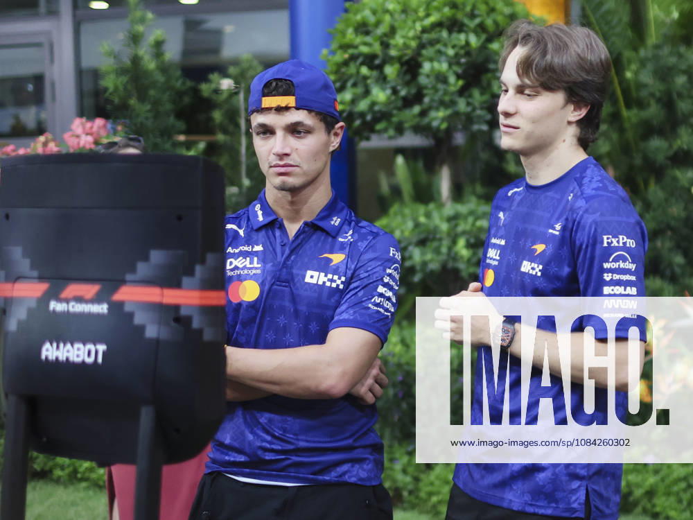 LANDO NORRIS and OSCAR PIASTRI of McLaren Mastercard F1 Team interact with children during a video call in the team s hospitality area in the paddock ahead of the 2026 Formula 1 Singapore Grand Prix at Marina Bay Street Circuit in Singapore. Singapore Singapore - ZUMAh201 20261008_zsp_h201_035