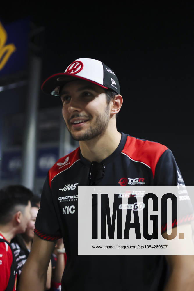 ESTEBAN OCON of MoneyGram Haas F1 Team rides an electric scooter through the paddock as he heads back to the team s hospitality area ahead of the 2026 Formula 1 Singapore Grand Prix at Marina Bay Street Circuit in Singapore. Singapore Singapore - ZUMAh201 20261008_zsp_h201_040