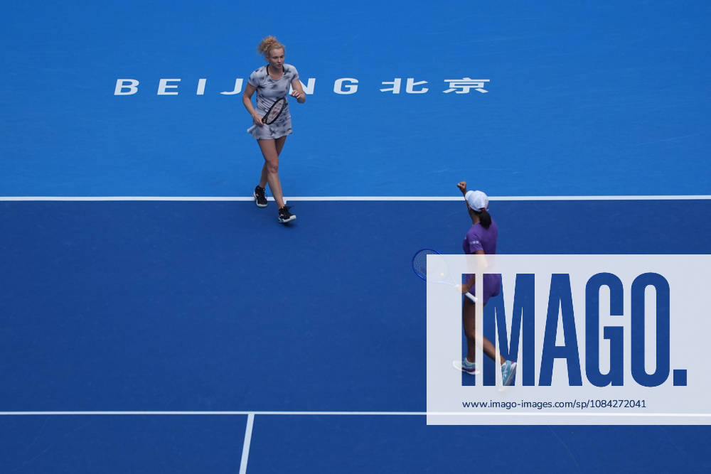 (261009) -- BEIJING, Oct. 9, 2026 -- Katerina Siniakova (L) Zhang Shuai celebrate scoring during the women s doubles quarterfinal match between Katerina Siniakova (the Cezch Republic) Zhang Shuai (China) and Storm Hunter (Australia) Kristina Mladenovic (France) at 2026 China Open tennis tournament in Beijing, China, Oct. 9, 2026. ) (SP)CHINA-BEIJING-TENNIS-CHINA OPEN-WOMEN S DOUBLES (CN) XiexHan