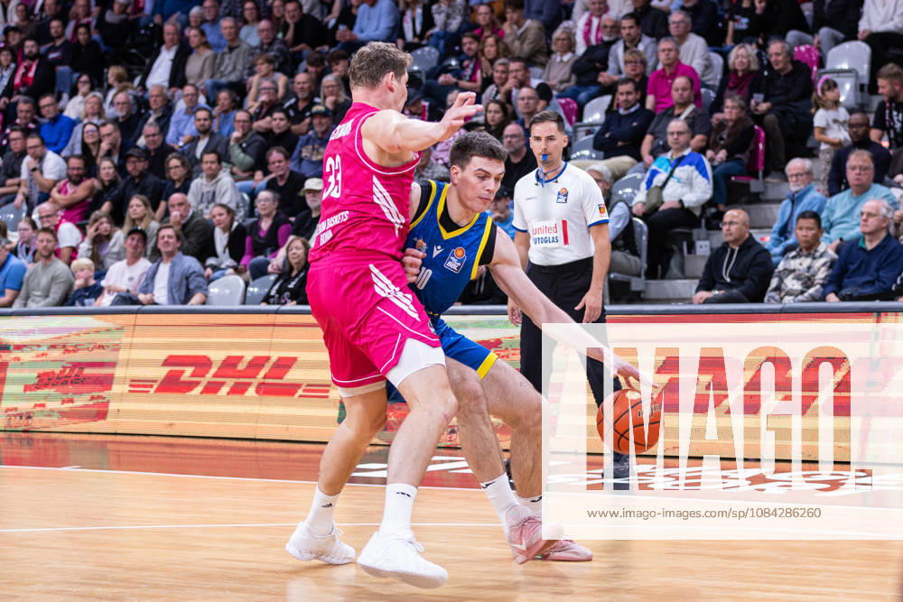 EasyCredit Basketball Bundesliga, Telekom Baskets Bonn vs. Science City Jena, October 9, 2026: Christian Skladanowski (Science City Jena) 10 and Patrick Heckmann (Telekom Baskets Bonn) 33; easyCredit Basketball Bundesliga, Telekom Baskets Bonn vs. Science City Jena, October 9, 2026, Telekom Dome Bonn