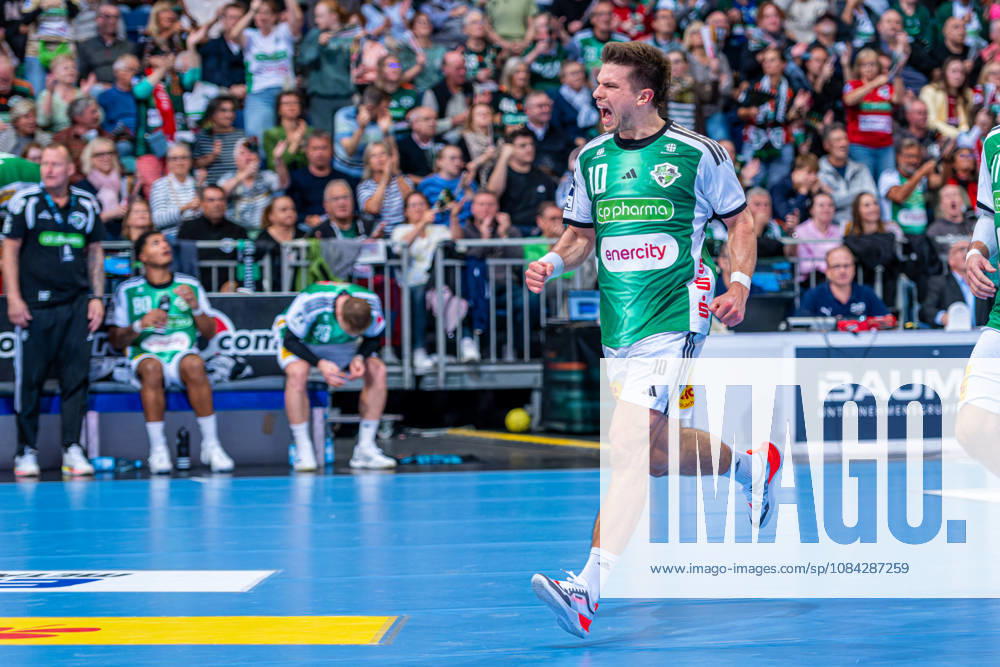 Renars Uscins of TSV Hannover Burgdorf, No. 10 from the left, TSV Hannover Burgdorf (green) vs. SG Flensburg Handewitt (blue) on Matchday 8 of the 2026–2027 season in the Opel Handball Bundesliga on October 9, 2026, ZAG Arena Hannover, GER,