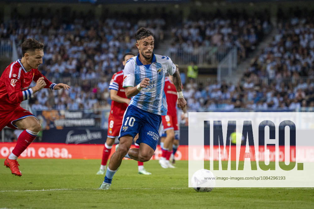 David Larrubia (N10) runs with the ball during La Liga match between Malaga and RCD Espanyol at the Estadio de la Rosaleda on the 9th of October, 2026 in Malaga, Spain