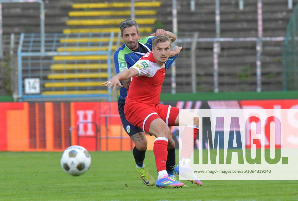 GER, Soccer, Regionalliga West, 2026–2027 Season, Matchday 12, Ohlendorf Stadium in Heidewald, Gütersloh FC vs. SF Siegen 0–5, Kevin Hingerl (FC Gütersloh, left) vs. Elias Paul Huth (SF Siegen), action, duel, tackle