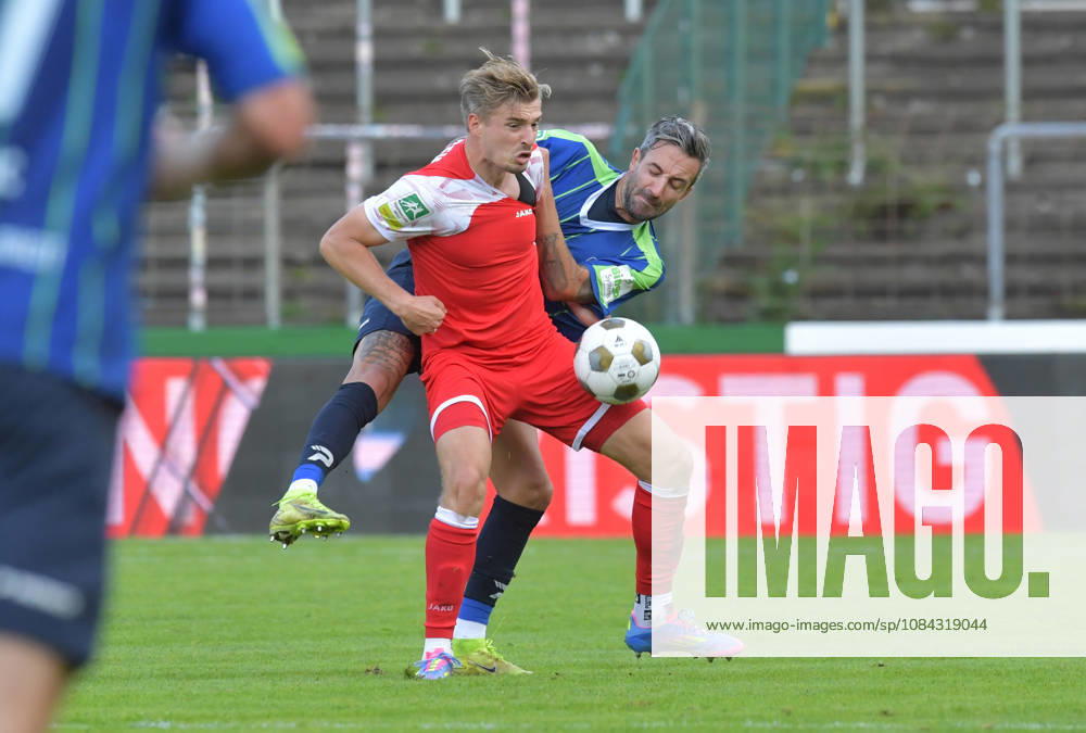 GER, Soccer, Regionalliga West, 2026–2027 Season, Matchday 12, Ohlendorf Stadium in Heidewald, Gütersloh FC vs. SF Siegen 0–5, Kevin Hingerl (FC Gütersloh, right) vs. Elias Paul Huth (SF Siegen), action, duel, tackle