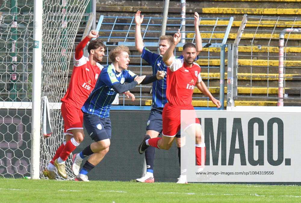GER, Soccer, Regionalliga West, 2026–2027 Season, Matchday 12, Ohlendorf Stadium in Heidewald, Gütersloh FC vs. SF Siegen 0–5 Goal celebration: SF Siegen goal scorer Serhat Semih Güler; SF Siegen celebrates the 0–2 goal, Erik Lanfer (FC Gütersloh) protests a handball call; action; still frame; wide shot; facial expressions; gestures; celebration; cheering; joy; delight