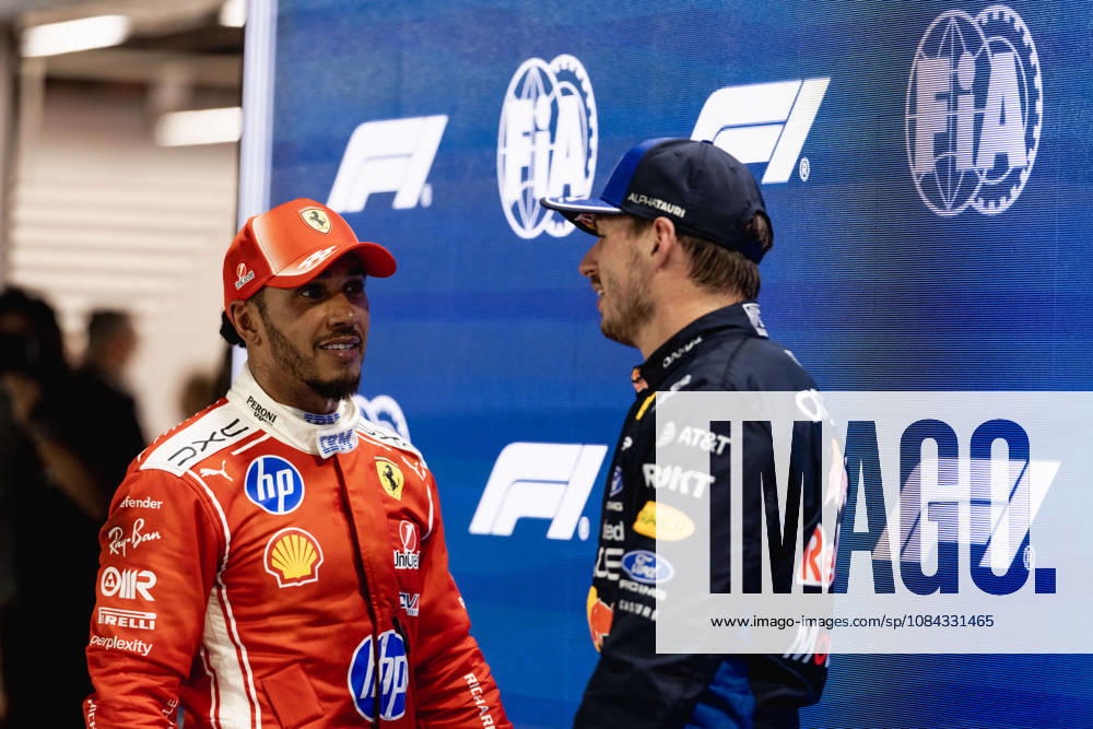 Lewis Hamilton of Great Britain and Scuderia Ferrari HP and Max Verstappen of the Netherlands and Oracle Red Bull Racing at Parc Ferme after qualifying for F1 Grand Prix race of Singapore at Marina Bay Street Circuit on October 10, 2026 in Singapore, Singapore. (Photo by Qian Jun SPP-Paddocker)