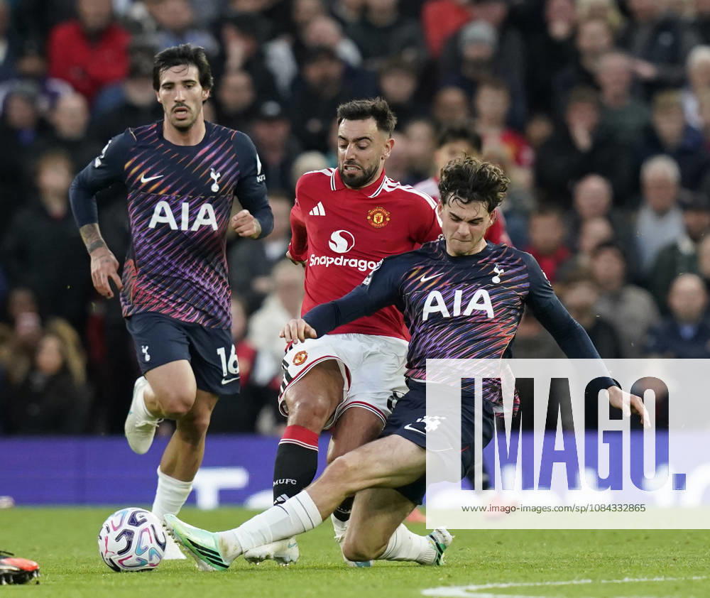 Manchester, England, 10th October 2026. Bruno Fernandes of Manchester United, ManU tackled by Archie Gray of Tottenham during the Manchester United vs Tottenham Hotspur Premier League match at Old Trafford, Manchester. Picture credit should read: Andrew Yates Sportimage . SPI_042_AY_MANUTD_SPURS SPI-5058-0042