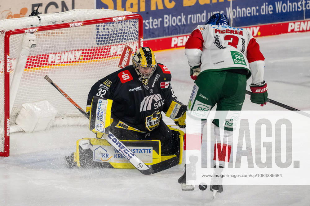 Alec McCrea of the Augsburger Panther, No. 03, fumbles the puck in front of Juha Jatkola of the Krefeld Pinguine, No. 32. Krefeld Pinguine vs. Augsburger Panther, ice hockey, Penny DEL, Matchday 8, 2026–2027 season, October 11, 2026, Krefeld Pinguine vs. Augsburger Panther, Ice Hockey, Penny DEL, Matchday 8, 2026–2027 Season, October 11, 2026, Krefeld