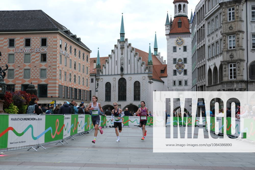 Munich Marathon 2026 MUNICH, GERMANY - OCTOBER 11: Three runners compete through Marienplatz passing the Old Town Hall during the 2026 Munich Marathon in Munich, Germany on October 11, 2026. The annual race takes participants through central landmarks of the Bavarian capital. Merve Goettl Anadolu Munih Germany. Editorial use only. Please get in touch for any other usage.