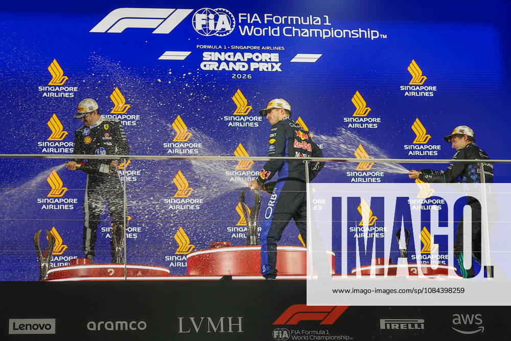 2026 Formula 1 Singapore Grand Prix SINGAPORE - OCT 11: Red Bull Racing driver Max Verstappen (C) celebrates with Ferrari s Charles Leclerc (L) and Mercedes’s Kimi Antonelli (R) on the podium, after winning the Formula 1 Singapore Grand Prix at the Marina Bay Street Circuit in Singapore on October 11, 2026. Daniel Ceng Anadolu Singapore Singapore. Editorial use only. Please get in touch for any other usage.