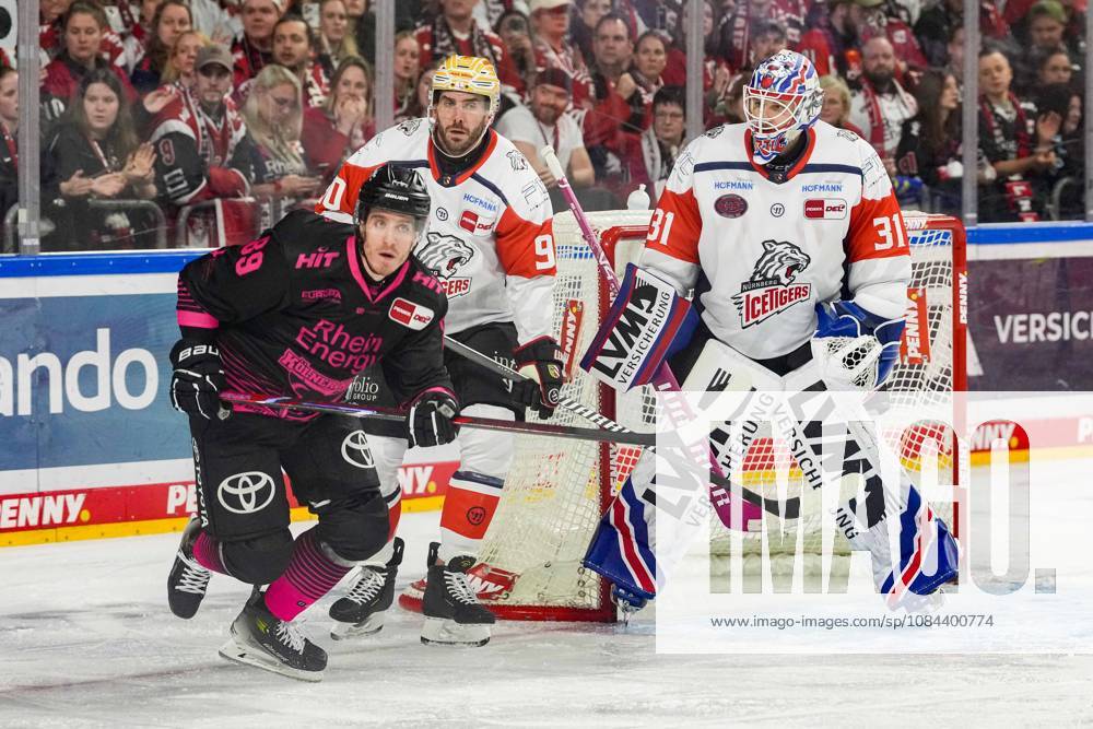 Ice Hockey: Penny DEL, Matchday 8—Cologne Sharks vs. Nuremberg Ice Tigers on October 11, 2026, at the Lanxess Arena in Cologne. Gregor MacLeod (Cologne), left: Constantin Braun (Nuremberg), center: Niklas Treutle (Nuremberg), right: In accordance with the guidelines of the DEL (German Ice Hockey League), the publication and further use of the images in electronic media and on devices of any kind during the game is not permitted