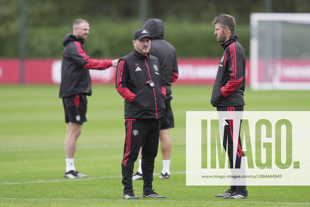 Manchester United, ManU Training, Champions League Manchester United assistant manager Steve Holland speaks with Manchester United manager Michael Carrick during the Manchester United Training Session at Carrington Training Centre, ahead of the UEFA Champions League Matchday 2 v Atletico Madrid, Manchester, England on 12 October 2026 Credit: Steve Flynn Every Second Media Editorial use only. All images are copyright Every Second Media Limited. No images may be reproduced without prior permission.