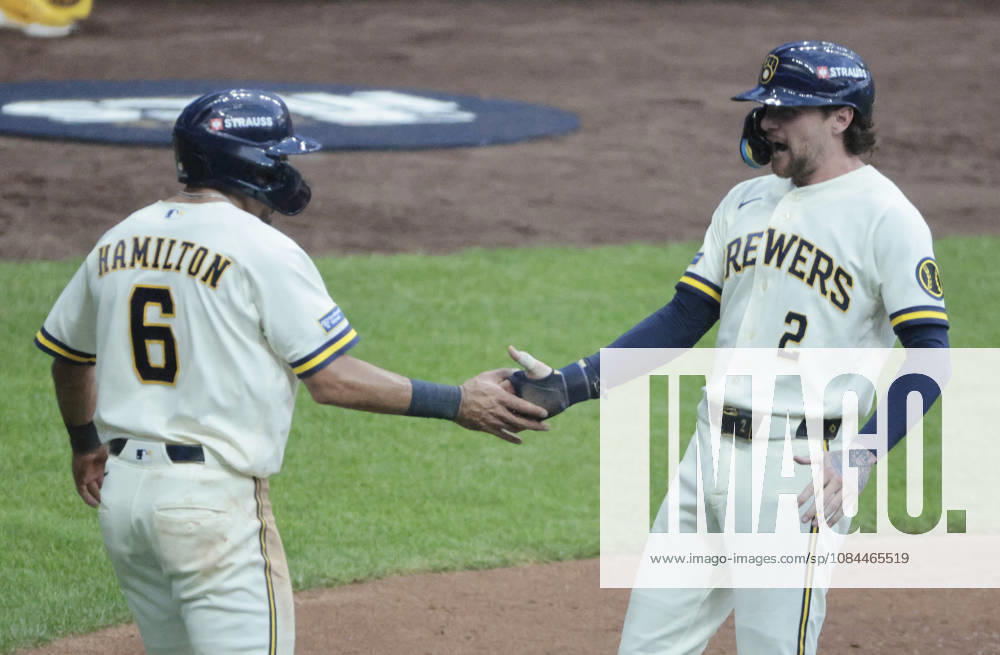 Milwaukee Brewers Brice Turang (2) is congratulated by David Hamilton (6) after scoring on a third inning single by Christian Yelich against the Los Angeles Dodgers in game two of the MLB, Baseball Herren, USA National League Championship Series at American Family Field in Milwaukee, Wisconsin, on Monday, October 12, 2026. MIL20261012715 TANNENxMAURY